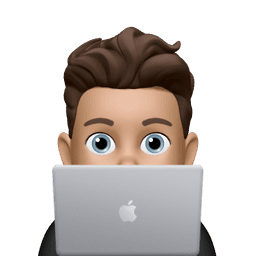 Memoji sitting on Macbbok